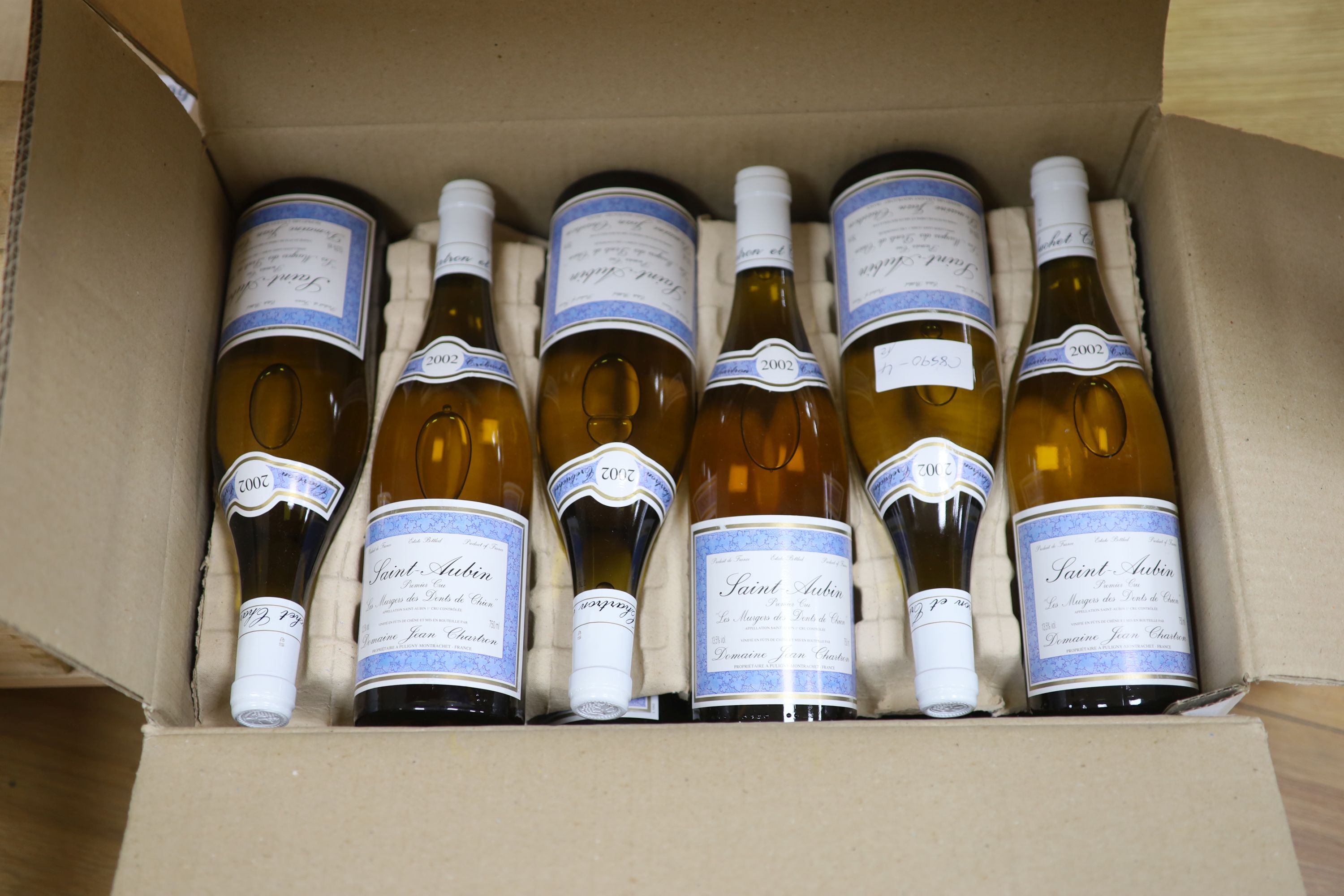 Twelve bottles of Domaine Jean Chartron St. Aubin 1er Cru Les Murgwers des Dents de Chien, 2002